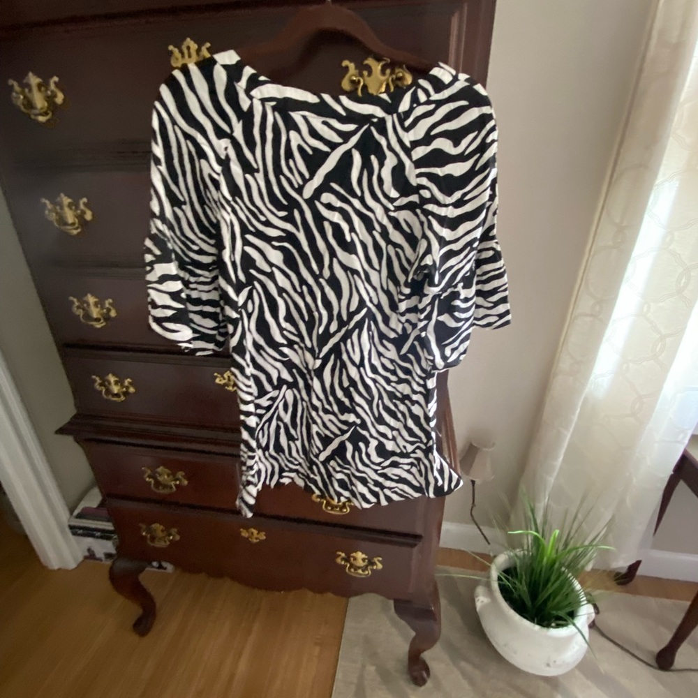 Woman’s INC top.